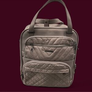 Dusty pink travel suitcase